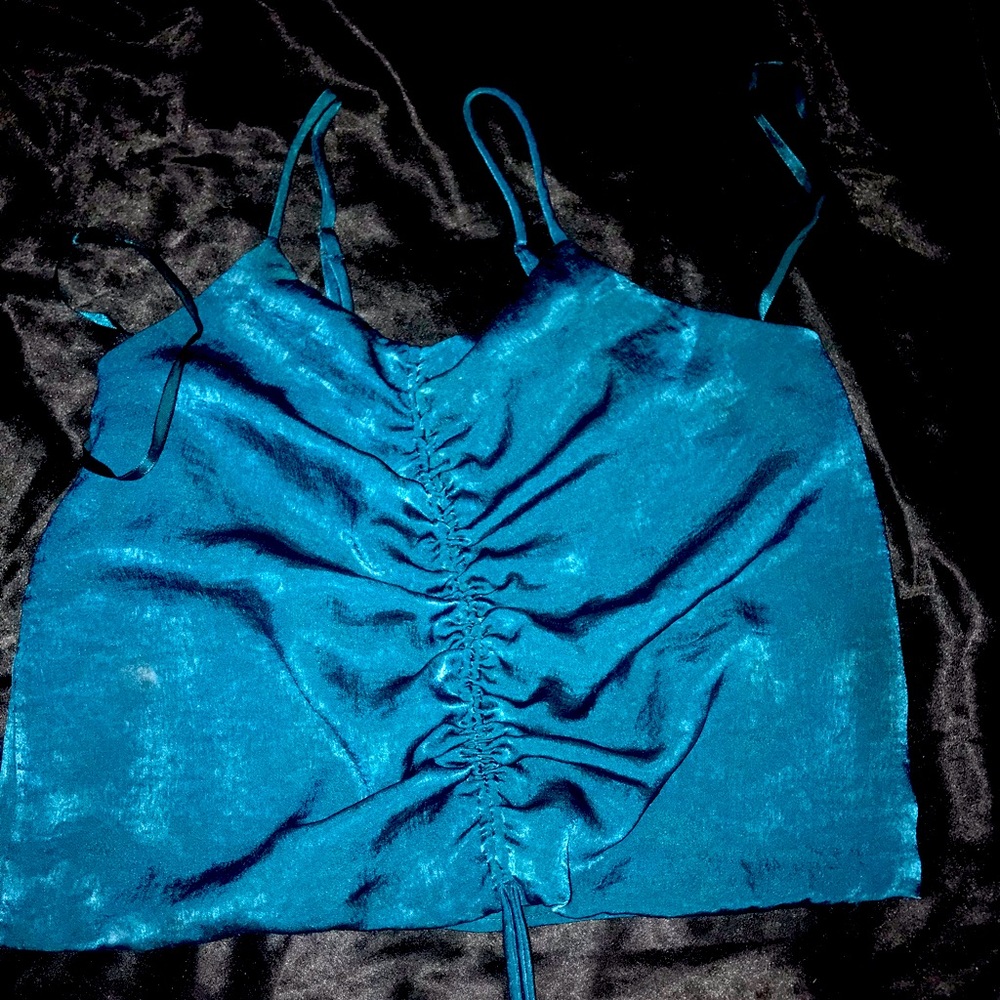 A blue green silk top never worn